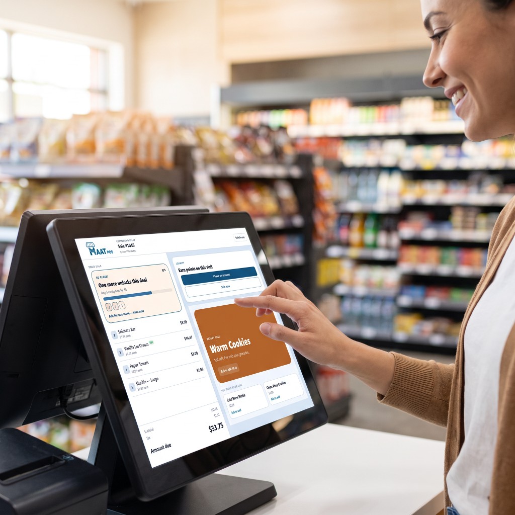 Customer tapping the HAAT POS customer display for a deal and loyalty